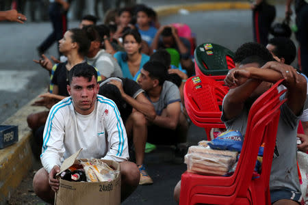 People detained by security forces after looting broke out during an ongoing blackout are pictured in Caracas, Venezuela, March 10, 2019. REUTERS/Ivan Alvarado