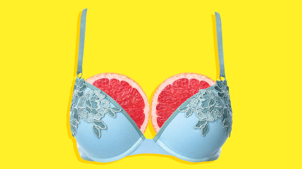 Grapefruit breasts in a bra.