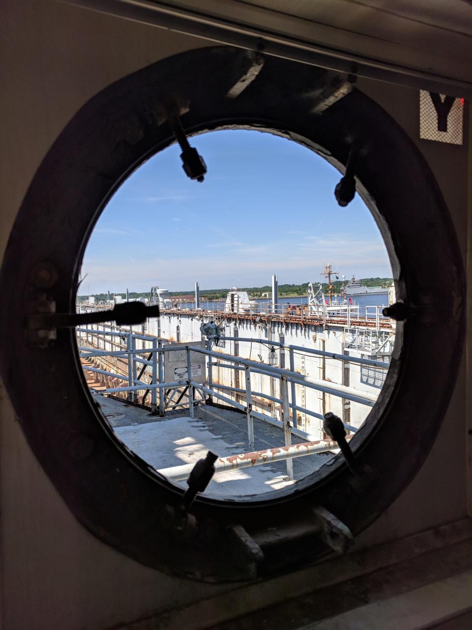 Looking through our porthole at the dock of the USS OAK RIDGE, which will be displayed in Oak Ridge, Tennessee.