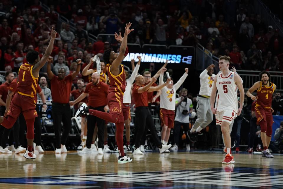 Iowa State players react in front of Wisconsin's Tyler Wahl after a second-round NCAA college basketball tournament game Sunday, March 20, 2022, in Milwaukee. Iowa State won 54-49. (AP Photo/Morry Gash)