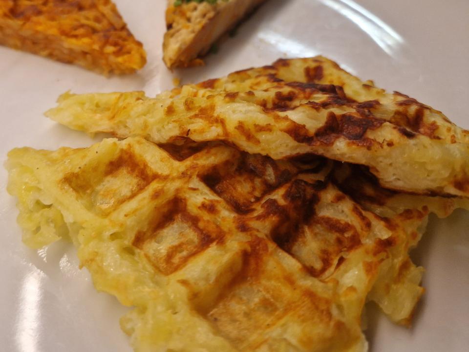 close up shot of waffle iron hash browns on a plate