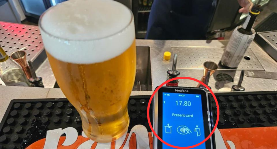 An image of a beer and an payment machine showing the price of the beer at $17.80.