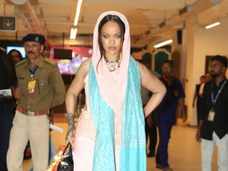 Rihanna poses for a picture before she leaves after performing at the pre-wedding celebrations of Anant Ambani and Radhika Merchant.