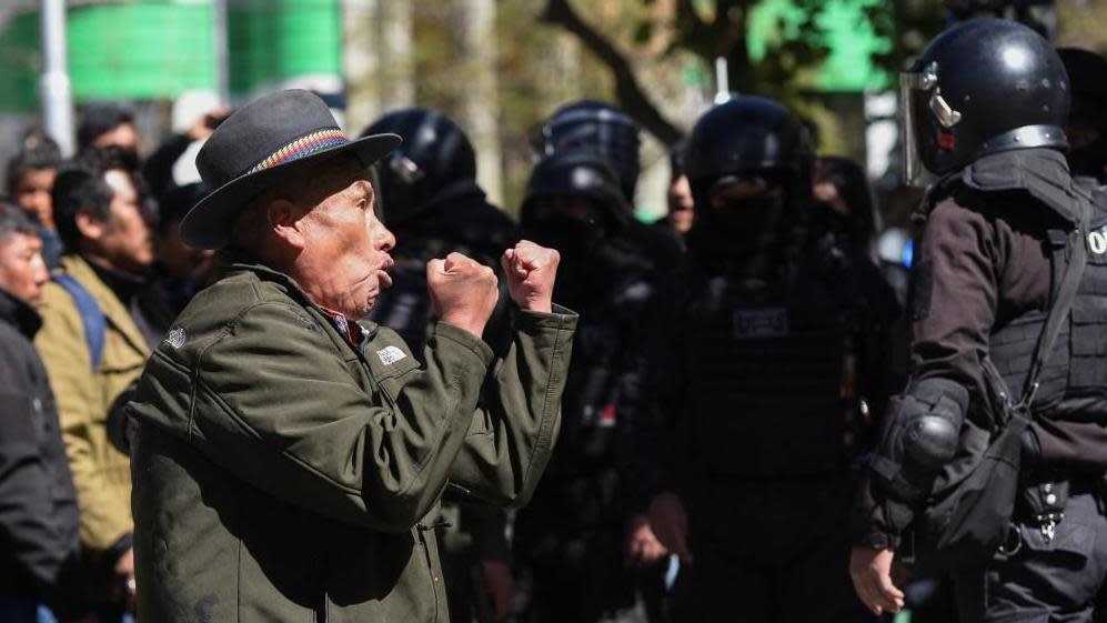 A man reacts during clashes between supporters of Bolivia's President Luis Arce and supporters of Bolivia's former President Evo Morales outside the Supreme Electoral Court, in La Paz, Bolivia July 10, 2024. 