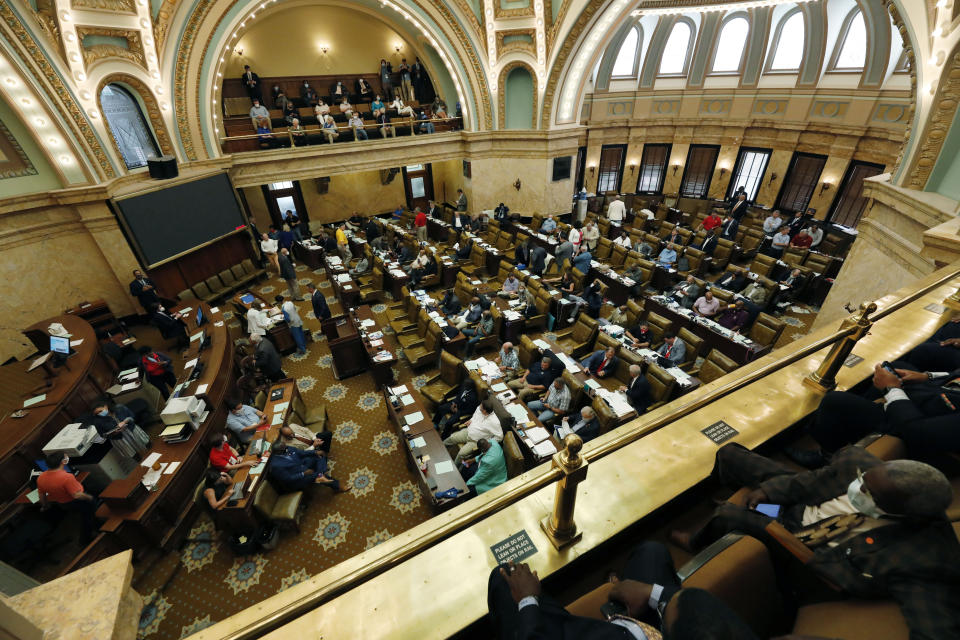 Observers watch the House consider a number of bills Saturday morning, June 27, 2020 at the Capitol in Jackson, Miss. Mississippi lawmakers could vote to remove the Confederate battle emblem from the state flag. The symbol has come under criticism amid nationwide protests against racial injustice. (AP Photo/Rogelio V. Solis)