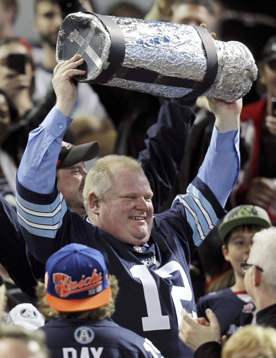 Toronto Mayor Rob Ford watches the CFL eastern final football game between the Toronto Argonauts and the Hamilton Tiger Cats in Toronto, November 17, 2013. REUTERS/Fred Thornhill (CANADA - Tags: SPORT FOOTBALL POLITICS TPX IMAGES OF THE DAY)