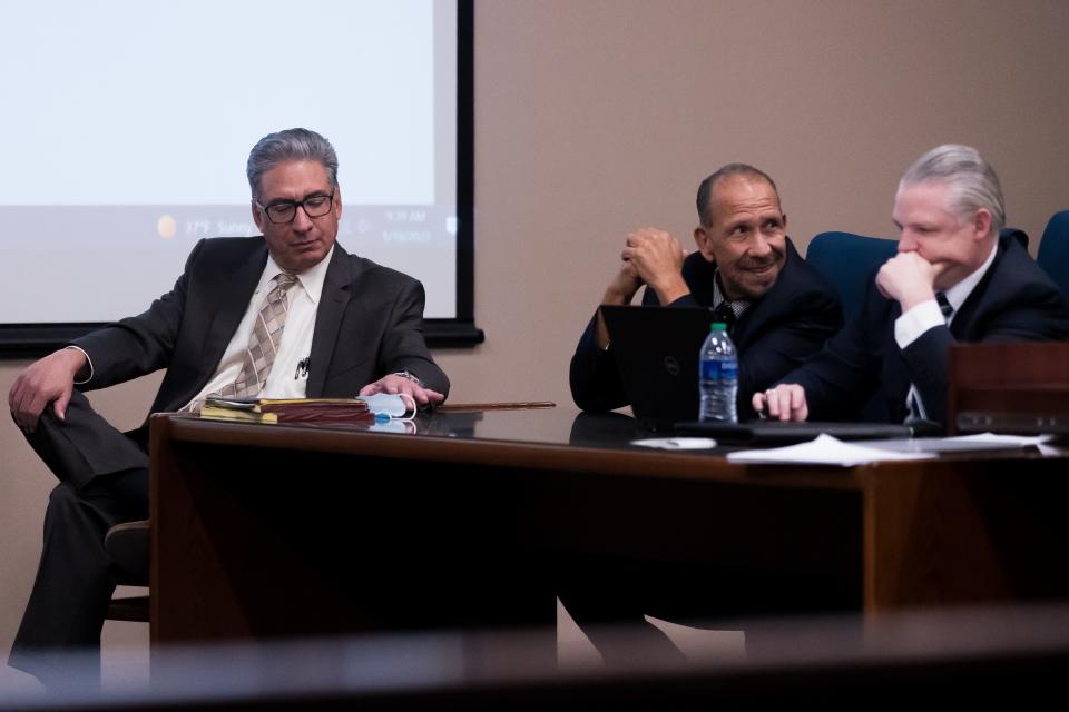 Kinfolk MC biker Manuel "Manny" Gallegos, center, talks to his attorneys before closing statements during his trial on Jan. 18 at the El Paso County Courthouse.