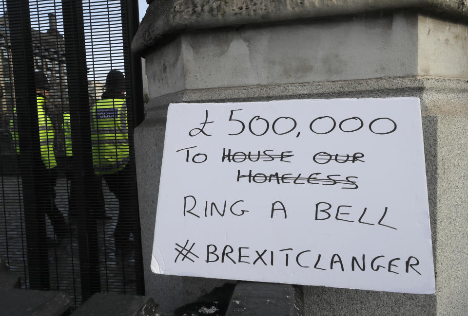 A banner placed by anti Brexit campaigners outside Parliament in London, Wednesday, Jan. 15, 2020. The Big Ben bell of Britain's Parliament has been largely silent since 2017 while its iconic clock tower undergoes four-years of renovation. Brexit-backing lawmakers are campaigning for it to strike at the moment Britain leaves the European Union at 11 p.m. (2300GMT) on Jan. 31, but some campaigners and officials say it is not worth the cost, which has been estimated at around 500,000 pounds (dollars 650,000 US). ( (AP Photo/Kirsty Wigglesworth)