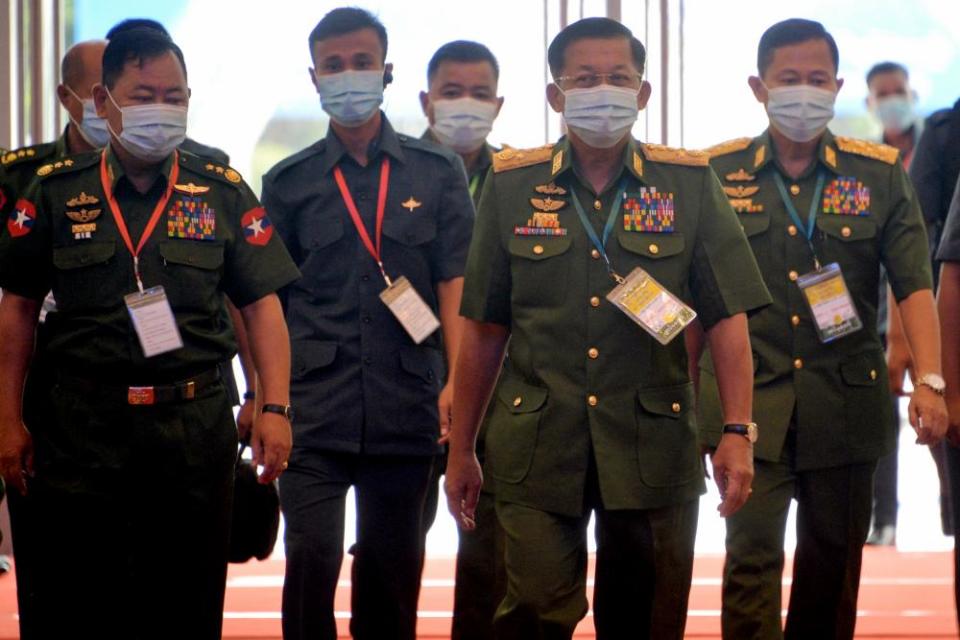 Generals Min Aung Hlaing, second right, and Soe Win, right, with home affairs minister Lieut General Soe Htut.