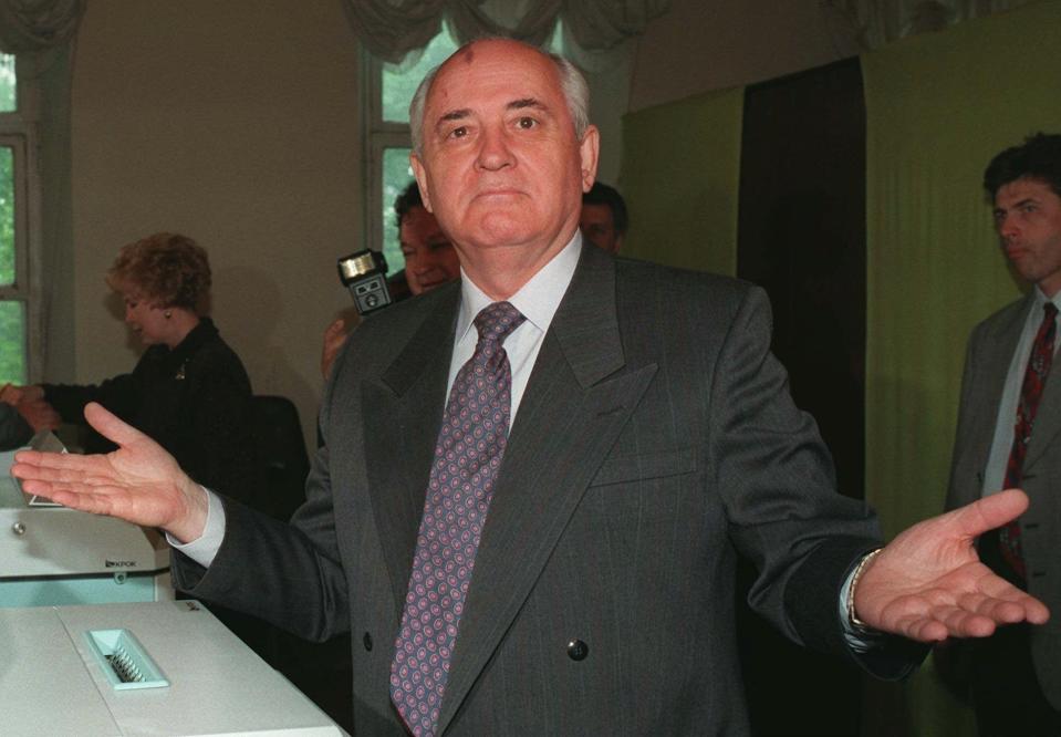 FILE - Former Soviet President and Russia's presidential candidate Mikhail Gorbachev gestures as he talks to reporters at a polling station in downtown Moscow, on June 16, 1996. Former Soviet leader Mikhail Gorbachev has died Tuesday Aug. 30, 2022 at a Moscow hospital at age 91. (AP Photo/Oleg Nikishin, File)