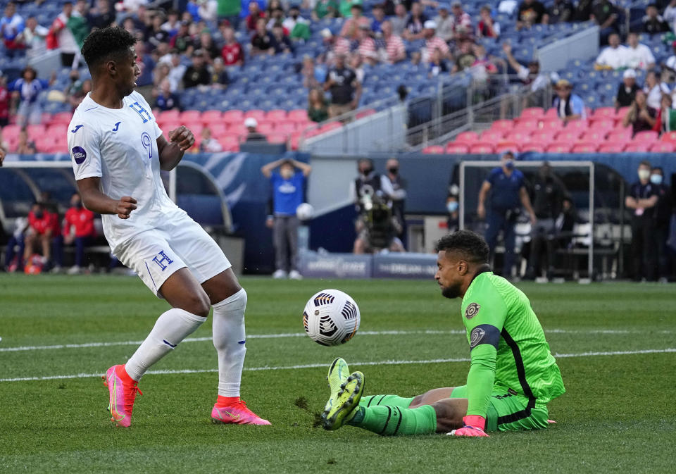 United States' Zack Steffen, right, blocks a shot by Honduras' Antony Lozano during the second half of a CONCACAF Nations League soccer semifinal Thursday, June 3, 2021, in Denver. (AP Photo/Jack Dempsey)