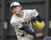 Japanese pitcher Roki Sasaki works out at a team camp of the World Baseball Classic, in Miyazaki, southern Japan, on Feb. 19, 2023. All eyes will be on Japanese baseball pitcher Sasaki at the World Baseball Classic. He is regarded as the next big thing in baseball out of Japan. (Kyodo News via AP)