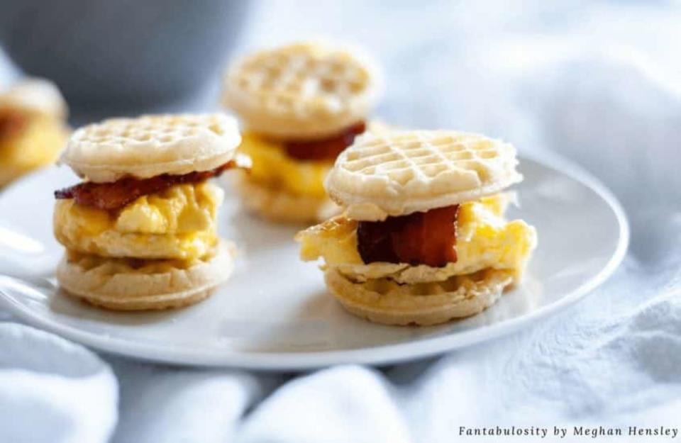 <p>Fantabulosity</p><p>Breakfast sandwiches are easy to make at home with this delicious recipe for Mini Waffle Breakfast Sandwiches. Using Mini Waffles as the way to carry the sandwich, packed with scrambled eggs and crispy bacon, you'll be full and ready to tackle the day. </p><p><strong>Get The Recipe: <a href="https://fantabulosity.com/easy-breakfast-idea-mini-waffle-breakfast-sandwiches/" rel="nofollow noopener" target="_blank" data-ylk="slk:Mini Waffle Breakfast Sandwiches;elm:context_link;itc:0;sec:content-canvas" class="link ">Mini Waffle Breakfast Sandwiches</a></strong></p>
