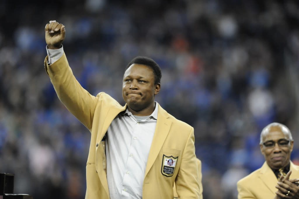 Detroit Lions running back Barry Sanders acknowledges the crowd after receiving a Pro Football Hall of Fame ring during a ceremony at halftime of an NFL football game between the Lions and the Chicago Bears, Oct. 18, 2015, in Detroit. (AP Photo/Jose Juarez, File)