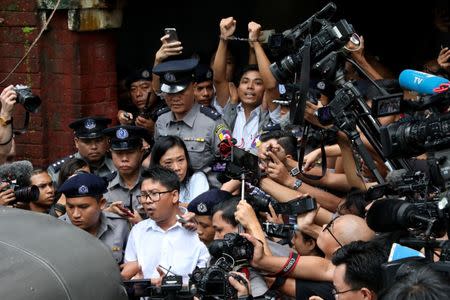 Detained Reuters journalists Wa Lone and Kyaw Soe Oo leave Insein court after listening to the verdict in Yangon, Myanmar September 3, 2018. REUTERS/Stringer/Files