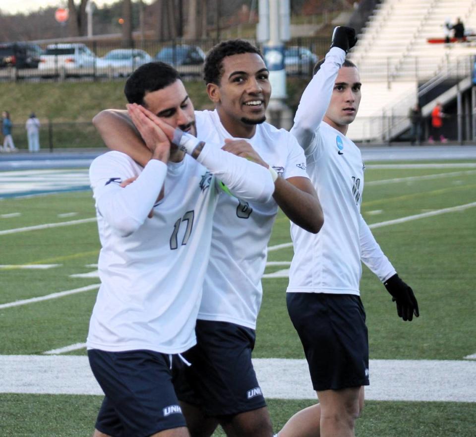 University of New Hampshire midfielder Yannick Bright (middle) celebrates with teammates Eli Goldman, left, and Georgios Koliniatis after a 3-0 win over Syracuse in a second-round NCAA playoff game in Durham, N.C. in November 2023. Bright was picked by Inter Miami with the No. 15 pick in the 2024 MLS SuperDraft