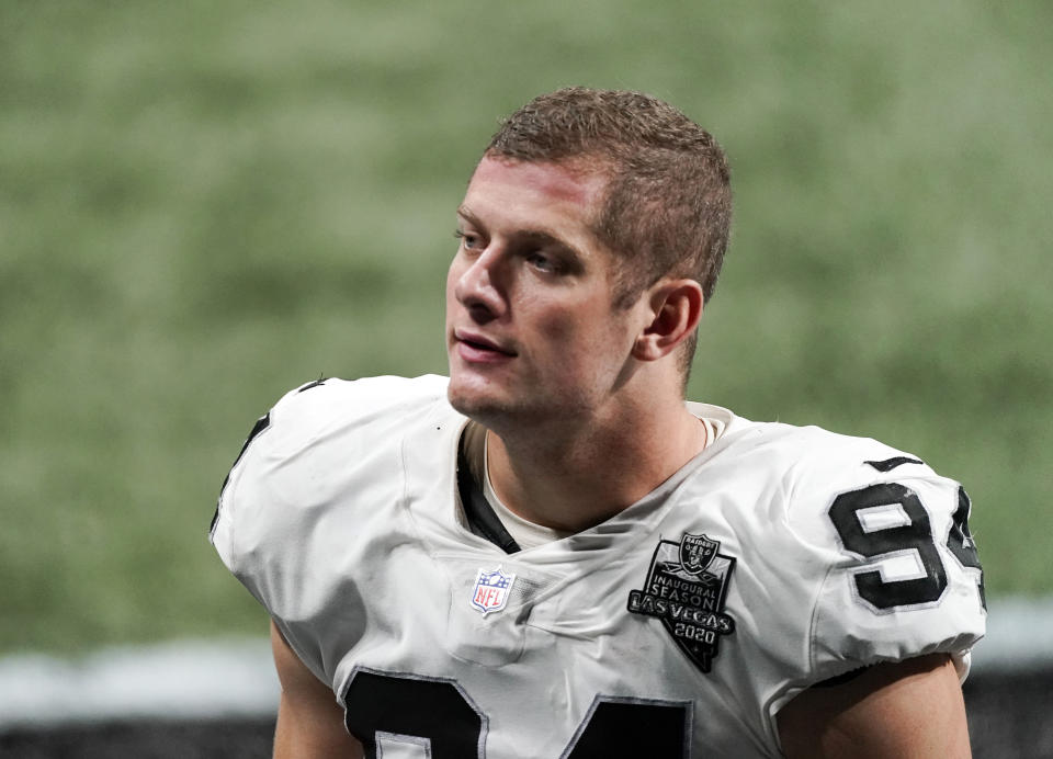 FILE - In this Nov. 29, 2020, file photo, Las Vegas Raiders defensive end Carl Nassib leaves the field after an NFL football game against the Atlanta Falcons in Atlanta. After decades of hang-wringing over the supposed negative impact a homosexual player would have on a team's chemistry, Nassib's brave announcement this past summer seems to have largely faded into the background. (AP Photo/John Bazemore, File)