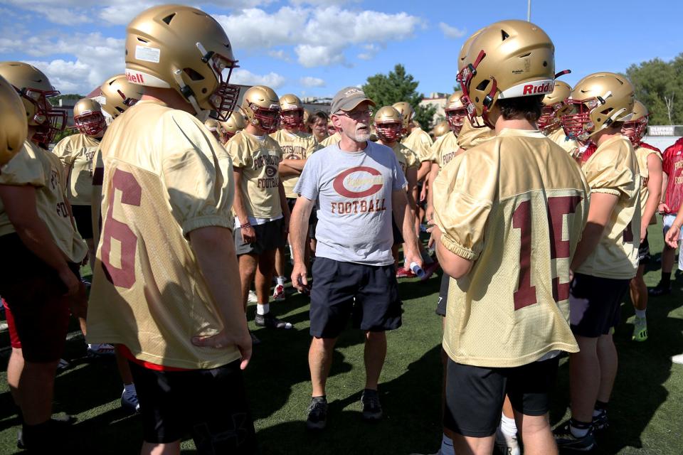 Coach Brian Pafford speaks to the Portsmouth-Oyster River High School football team at their first practice of the season on Friday, August 12, 2022.