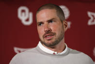 In this Friday, Aug. 2, 2019, photo, Oklahoma defensive coordinator Alex Grinch answers a question during the NCAA college football team's media day in Norman, Okla. Grinch, the man who previously rebuilt Washington State's defense and more recently was co-defensive coordinator at Ohio State, is bringing his aggressive approach to Oklahoma. (AP Photo/Sue Ogrocki)