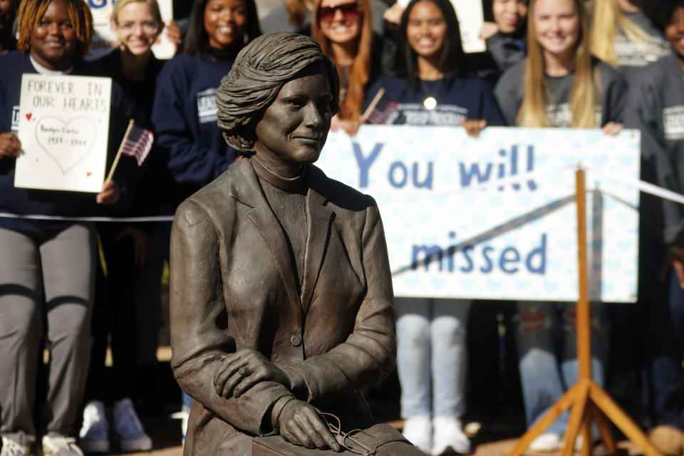 Students watch as family members participate in a wreath laying ceremony to honor former first lady Rosalynn Carter at the Rosalynn Carter Health & Human Services complex on the campus of Georgia Southwestern State University, Monday, Nov. 27, 2023, in Americus, Ga. The former first lady died on Nov. 19. She was 96. (AP Photo/John Bazemore, Pool)
