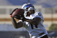 Las Vegas Raiders wide receiver Henry Ruggs III makes a catch during an NFL football practice Saturday, July 31, 2021, in Henderson, Nev. (AP Photo/David Becker)