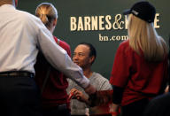 Golfer Tiger Woods signs copies of his new book "The 1997 Masters: My Story" at a book signing event at a Barnes & Noble store in New York City, New York, U.S., March 20, 2017. REUTERS/Mike Segar