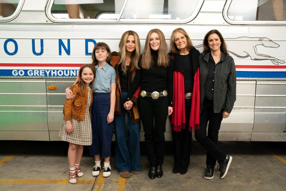 The stars of "The Glorias": Ryan Kiera Armstrong (from left), Lulu Wilson, Alicia Vikander and Julianne Moore, who play Gloria Steinem at different ages, with the real Gloria Steinem and director Julie Taymor.