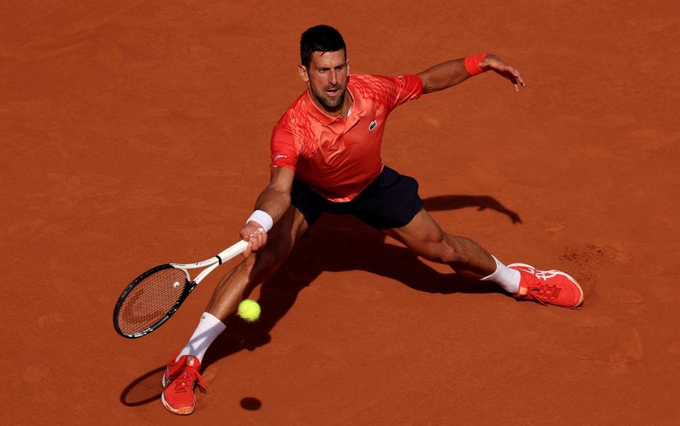 Novak Djokovic slides - Clive Brunskill/Getty Images)