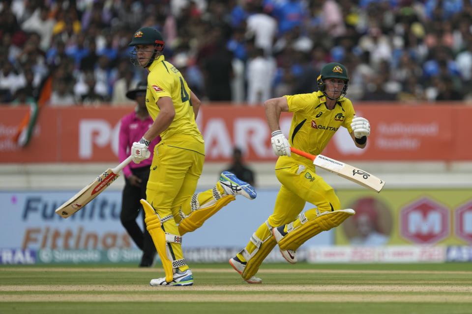 Australia's Cameron Green, right, and Marnus Labuschagne run between the wickets during the third one day international cricket match between Australia and India in Rajkot, India, Wednesday, Sept. 27, 2023. (AP Photo/Ajit Solanki)