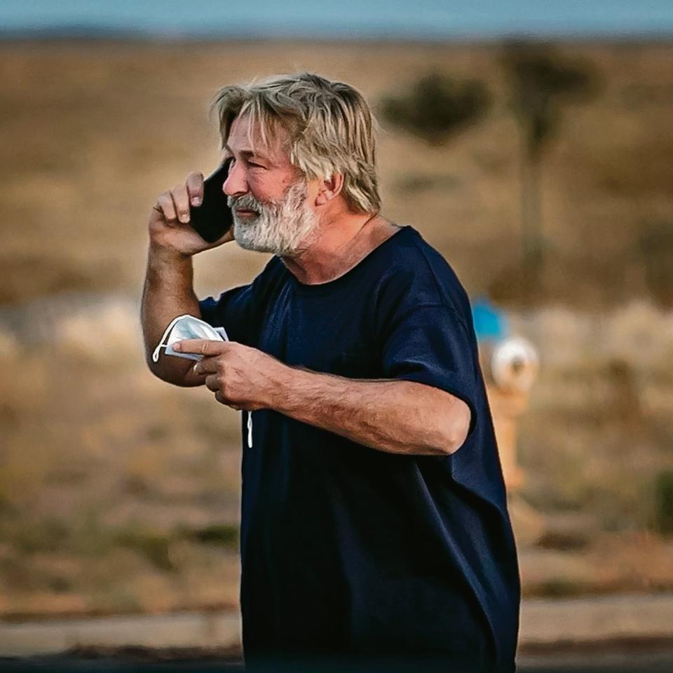 Alec Baldwin takes a call in the parking lot outside the Santa Fe County Sheriff's offices after being questioned on the shooting. (Jim Weber/The New Mexican / Jim Weber/The New Mexican)