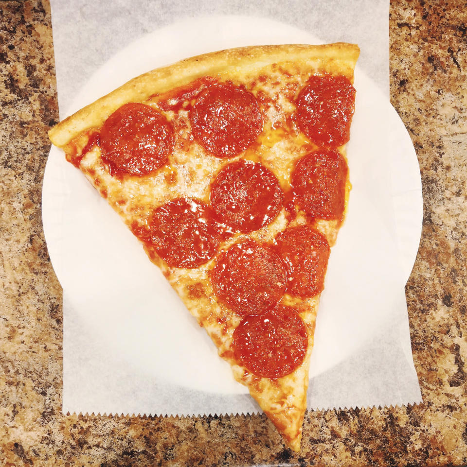 A slice of pepperoni pizza.