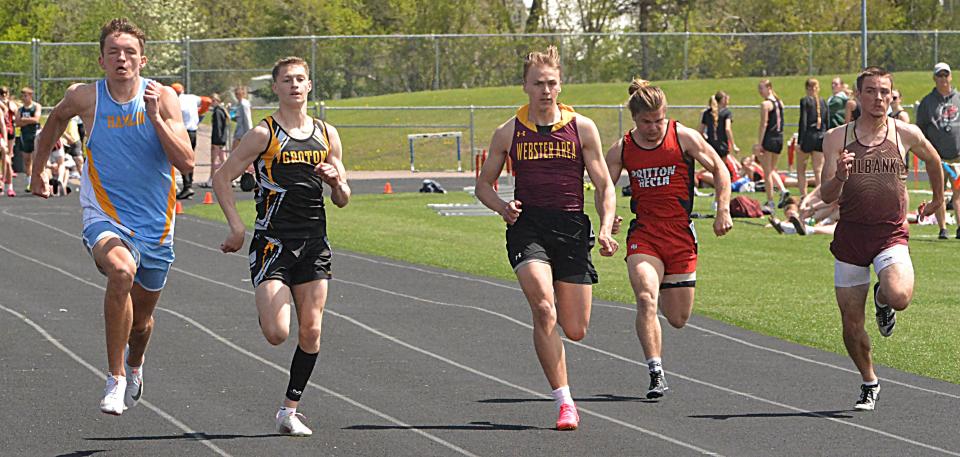 Runners, from left, Zac VanMeeteren of Hamlin, Keegen Tracy of Groton Area, Martin Dorsett of Webster Area, Dashel Davidson of Britton-Hecla and Jayden Johnson of Milbank run the boys' 100-meter dash during the Northeast Conference track and field meet on Thursday, May 9, 2024 at Sisseton. VanMeeteren won the 100, 200 and 400 dashes. Tracy was second in the 100, Dorsett fourth, Johnson seventh and Davidson ended up 10th.