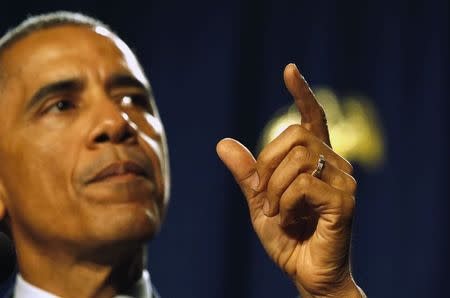 U.S. President Barack Obama makes a point with his finger as he delivers remarks at the House Democratic Issues Conference in Pennsylvania, January 29, 2015. REUTERS/Larry Downing