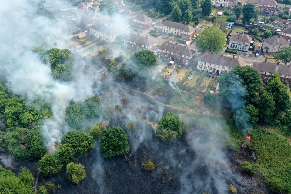 Firefighters contain a wildfire that encroached on nearby homes in the Shiregreen area of Sheffield on July 20, 2022 (Getty Images)