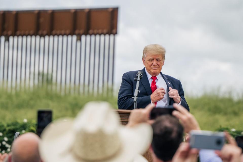 Former President Donald Trump at his unfinished border wall in June, in Pharr, Texas (Getty Images)