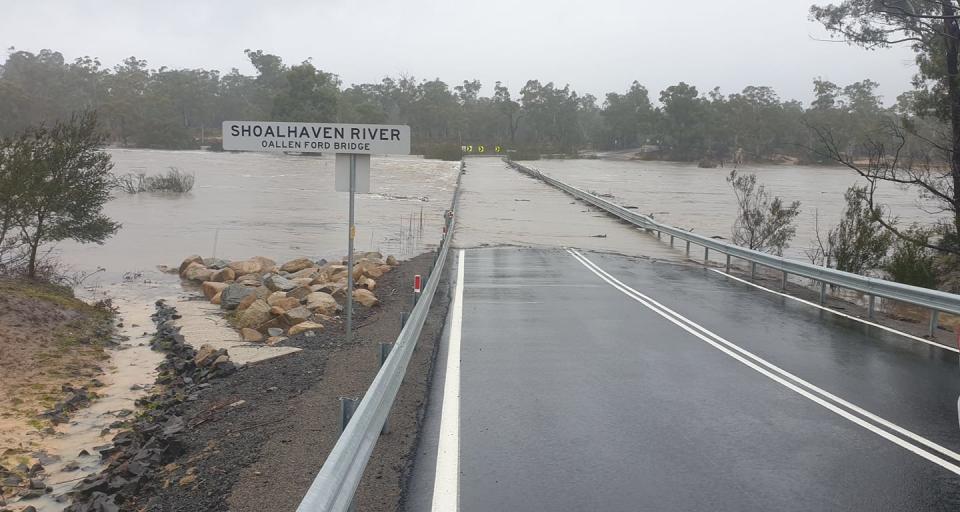 Oallen Bridge at Shoalhaven River is pictured flooded.
