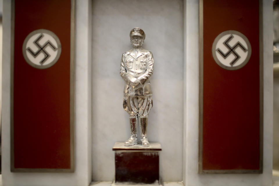 A statue of German Nazi leader Adolf Hitler discovered by police in 2017 is displayed during a press conference at the Holocaust museum in Buenos Aires, Argentina, Wednesday, Oct. 2, 2019. The museum took custody of the largest collection of Nazi artifacts discovered in the country’s history on Wednesday, after federal police and Interpol agents found a trove of more than 70 Nazi objects hidden behind a bookcase in a collector’s home north of Buenos Aires in June 2017. (AP Photo/Natacha Pisarenko)