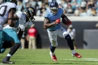 Sep 23, 2018; Jacksonville, FL, USA; Tennessee Titans running back Derrick Henry (22) runs the ball during the second half against the Jacksonville Jaguars at TIAA Bank Field. Mandatory Credit: Douglas DeFelice-USA TODAY Sports