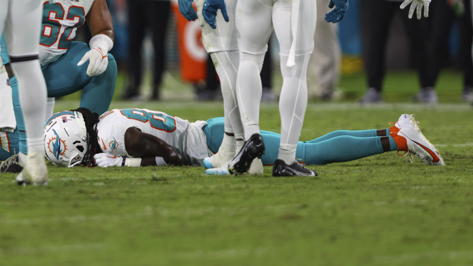 Miami Dolphins wide receiver Daewood Davis lies injured on the field during the second half of the team's NFL preseason football game against the Jacksonville Jaguars, Saturday, Aug. 26, 2023, in Jacksonville, Fla. (AP Photo/Gary McCullough)