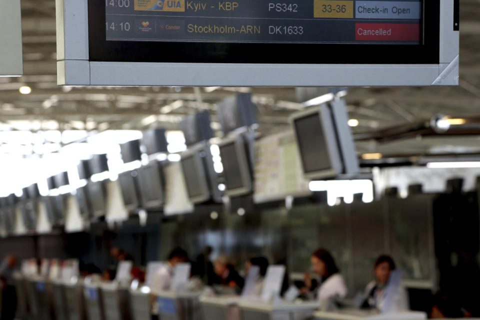 A flights screen showing a cancelled flight of Thomas Cook at Larnaca airport in the eastern Mediterranean island of Cyprus, Monday, Sept. 23, 2019. The collapse of Thomas Cook will strike a major blow to the Cypriot tourism industry. (AP Photo/Petros Karadjias)