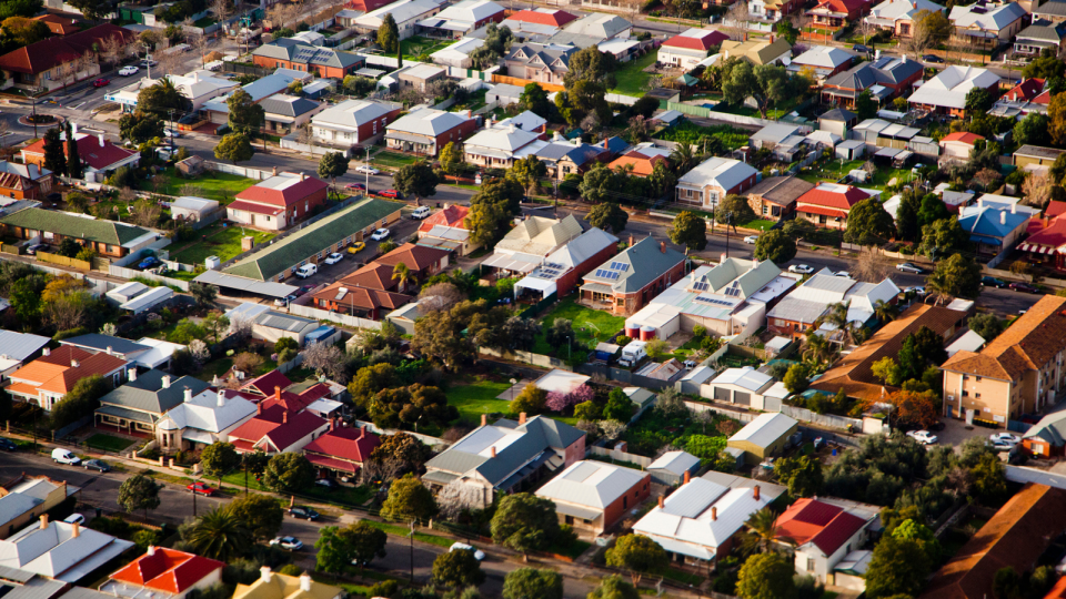 Aerial view of Australian houses at sunset. 