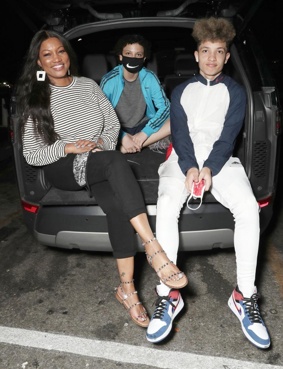 <p>Garcelle Beauvais and sons Jaid Thomas and Jax Joseph enjoy Amazon Studios and Outlier Society’s closing night of ‘A Night at the Drive-In’ on Wednesday at the Paramount Drive-In in L.A.</p>
