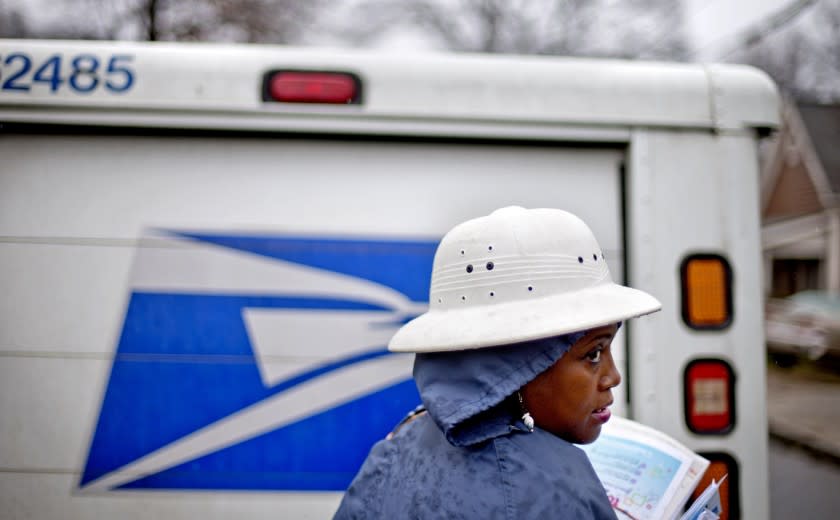 The U.S. Postal Service says it will delay plans to cut Saturday mail delivery because Congress isn't allowing the change.