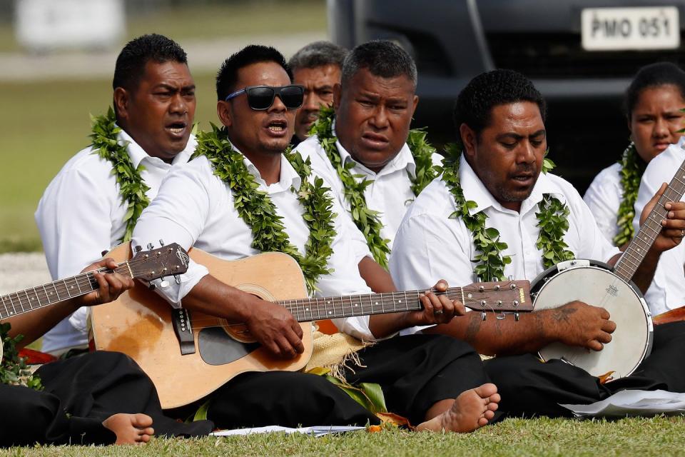 <p><strong>25 October </strong>Locals greet the Duke and Duchess of Sussex by playing music. </p>