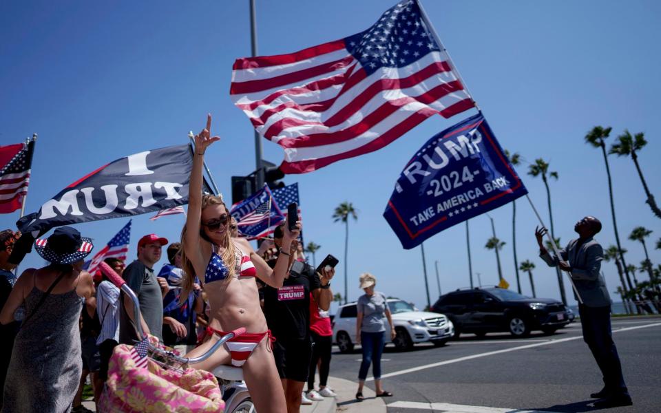 People rally in support of Republican presidential candidate former President Donald Trump in Huntington Beach, California