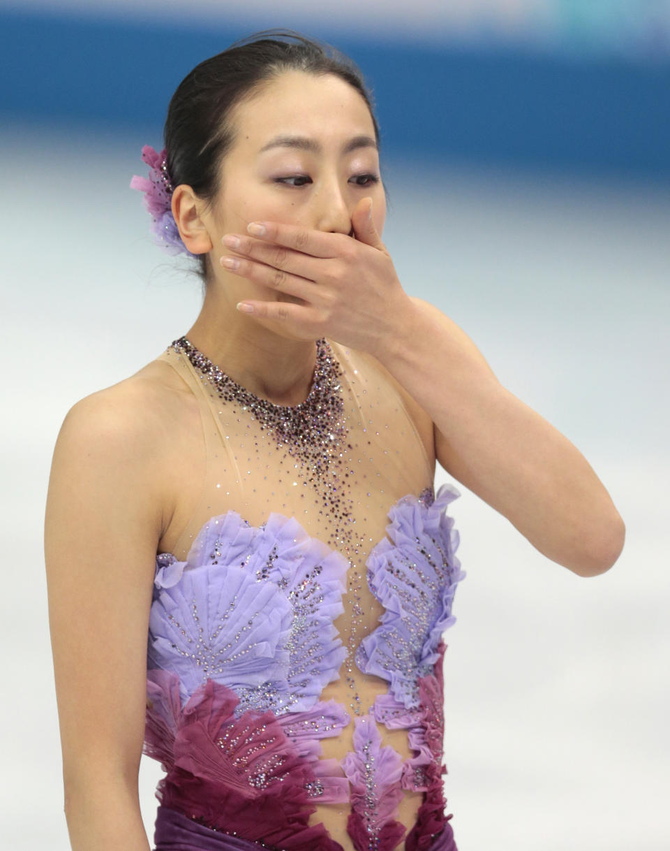 Mao Asada of Japan leaves the ice after competing in the women's team short program figure skating competition at the Iceberg Skating Palace during the 2014 Winter Olympics, Saturday, Feb. 8, 2014, in Sochi, Russia. (AP Photo/Ivan Sekretarev)