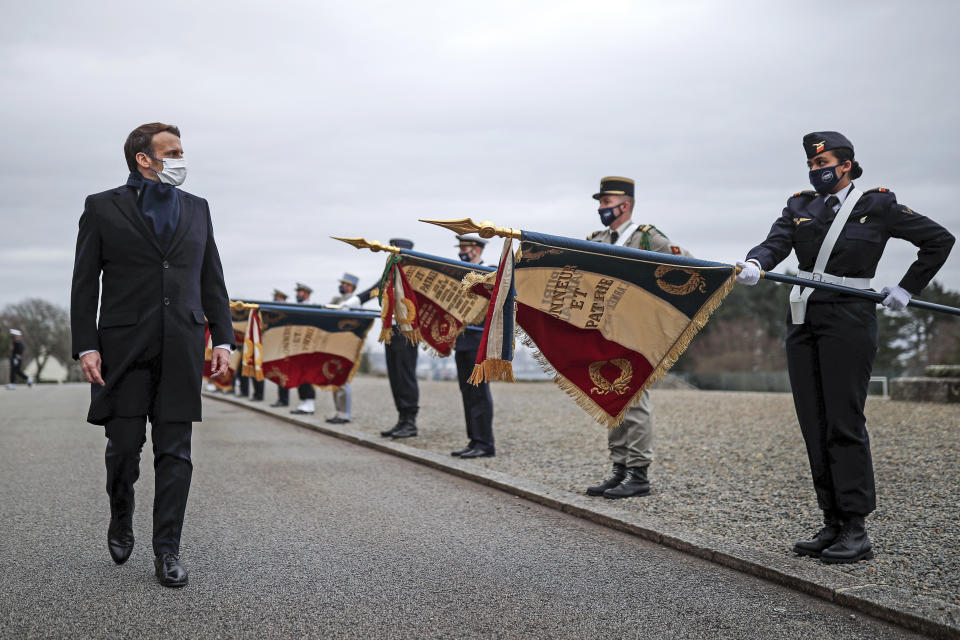 French President Emmanuel Macron review the troops prior to his New Year's speech to the French Armed Forces at Brest naval training center, western France, Tuesday, Jan. 19, 2021. (Stephane Mahe/Pool Photo via AP)