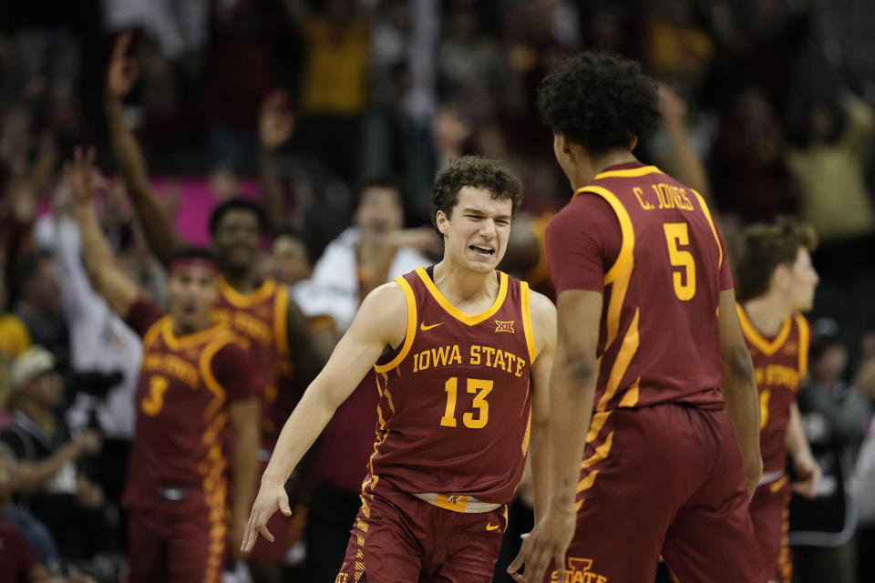 Iowa State guard Cade Kelderman (13) celebrates with guard Curtis Jones (5) after making a basket during the second half of an NCAA college basketball game in the championship of the Big 12 Conference tournament, Saturday, March 16, 2024, in Kansas City, Mo. Iowa State won 69-41. (AP Photo/Charlie Riedel)