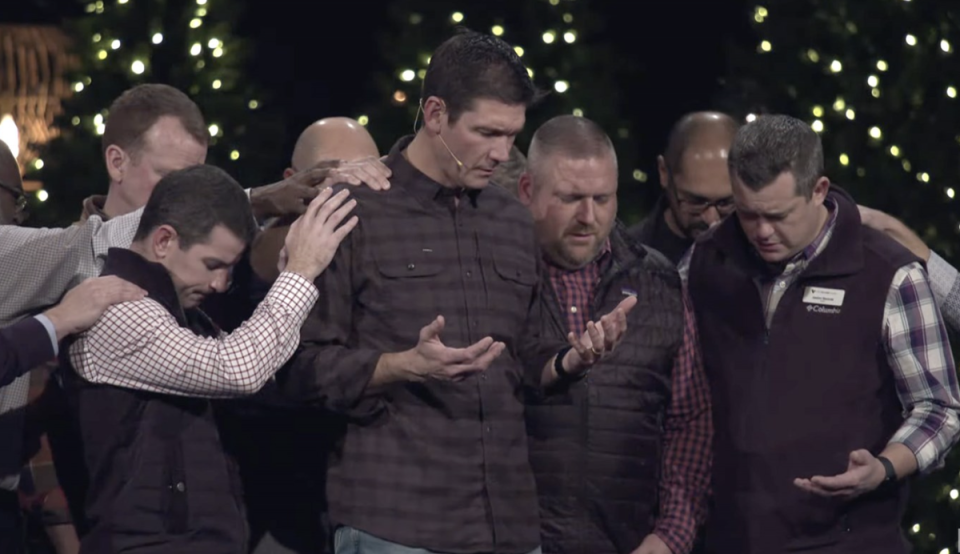 Matt Chandler, centre, returned to the Village Church in Dallas on Sunday after a three month leave of absence (Village Church / YouTube)