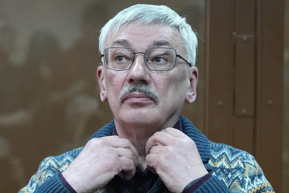 The co-chair of Nobel Peace Prize winning Memorial Human Rights Centre Oleg Orlov sits in a courtroom prior to a court session for a new trial on charges of repeated discrediting Russian military, in Moscow, Russia, on Tuesday, Feb. 27, 2024. (AP Photo/Alexander Zemlianichenko)